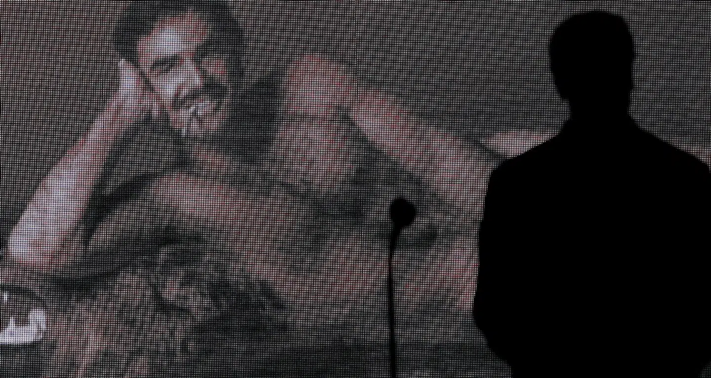 California's Governor Arnold Schwarzenegger is silhouetted against a picture of actor Burt Reynolds before announcing that the latter will receive the Honorary Award for Lifetime Achievement at the 2007 Taurus World Stunt Awards at Paramount Studios in Los Angeles May 20, 2007. The show honors the most outstanding stunt professionals from all over the world for their extraordinary performances. REUTERS/Mario Anzuoni (UNITED STATES)