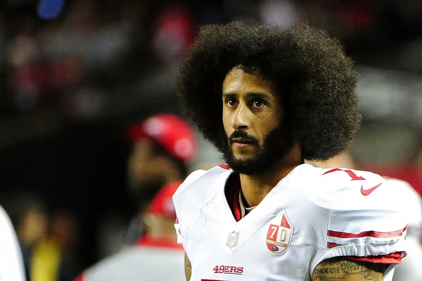 (FILES) This file photo taken on December 18, 2016 shows Colin Kaepernick #7 of the San Francisco 49ers looking on from the sidelines during the second half against the Atlanta Falcons at the Georgia Dome in Atlanta, Georgia. Former San Francisco 49ers quarterback Colin Kaepernick, an NFL free agent who last year began the kneeling protest during US anthems that became a major controversy, has filed a collusion grievance against the NFL, according to multiple reports on October 15, 2017. / AFP PHOTO / GETTY IMAGES NORTH AMERICA / Scott Cunningham