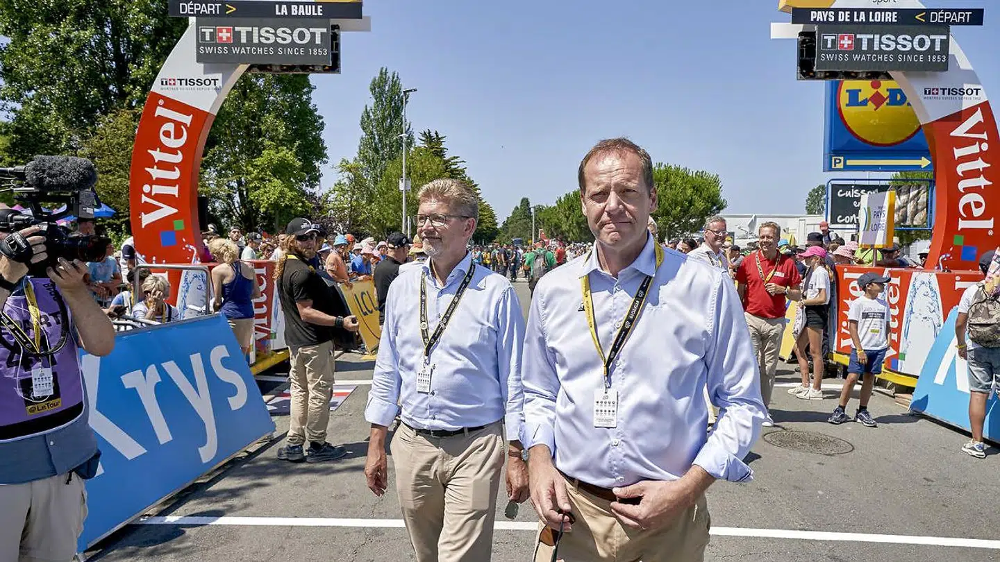 Københavns overborgmester, Frank Jensen, var inviteret ned til Tour de Frances fjerde etape af Christian Prudhomme (th.). Her fortalte Frank Jensen, at han havde en stærk tro på, at det i 2021 vil lykkes for at Touren til Danmark.
