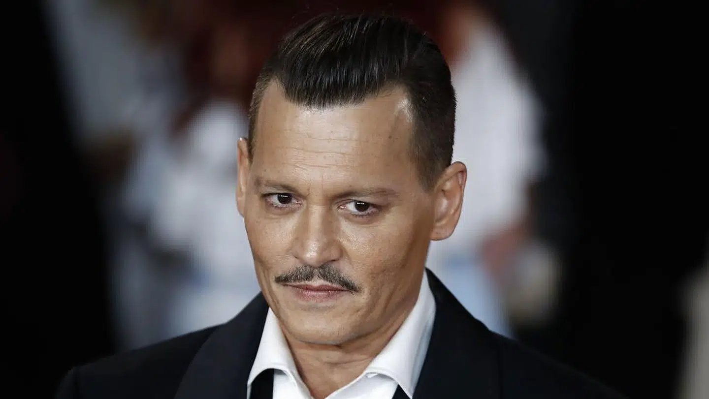 Johnny Depp har brugt flere hundrede tusinder på vin. Tolga AKMEN / AFP