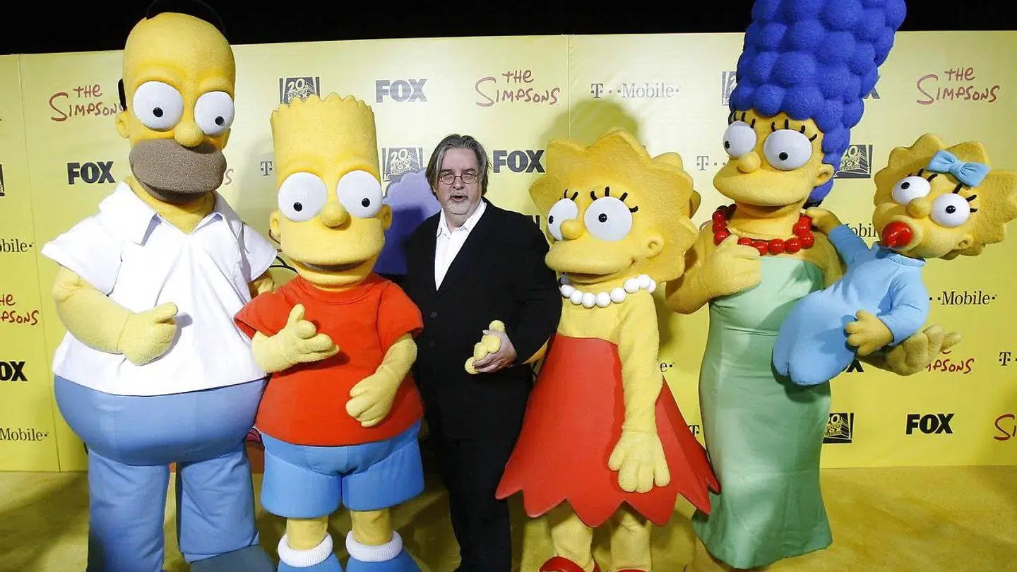 Figurerne fra The Simpsons sammen med skaberen af serien Matt Groening.