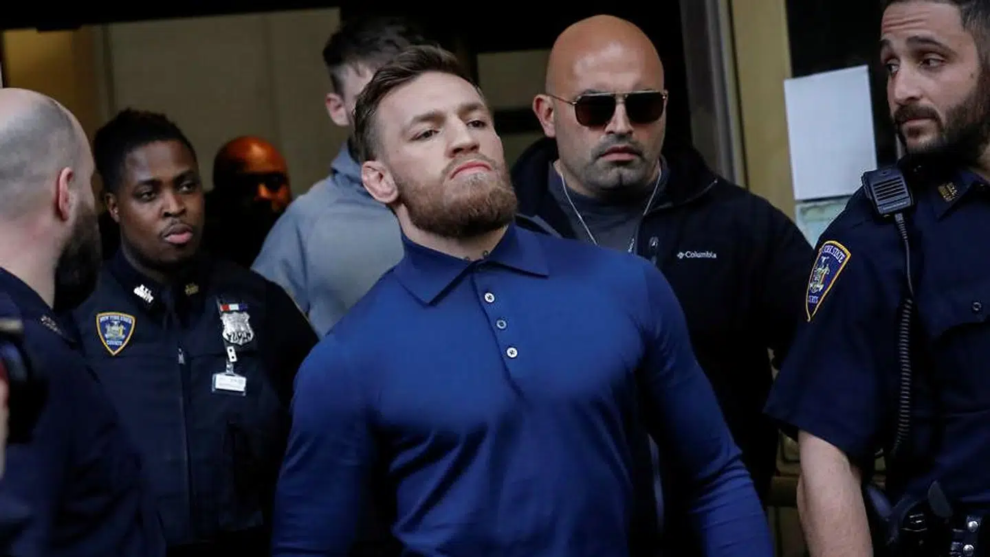 Mixed Martial Arts (MMA) fighter Conor McGregor exits after appearing in a Brooklyn court on charges of assault stemming from a melee, in the Brooklyn borough of New York City, U.S., April 6, 2018. REUTERS/Brendan McDermid