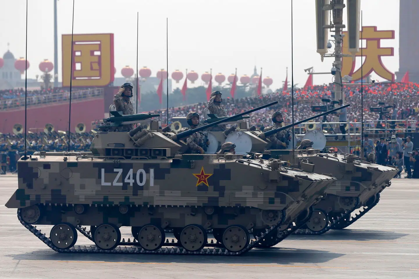 epa07884517 Chinese troops on military tanks roll past Tiananmen Square during a military parade marking the 70th anniversary of the founding of the People's Republic of China, in Beijing, China, 01 October 2019. China commemorates the 70th anniversary of the founding of the People's Republic of China on 01 October 2019 with a grand military parade and mass pageant. EPA/WU HONG