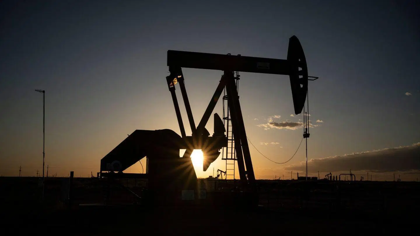 (FILES) In this file photo taken on April 23, 2020 Pump jacks operate near Loco Hills in Eddy County, New Mexico. - Oil prices have fallen by a quarter since mid-June and this shattering fallout could continue, especially in the event of an Iranian nuclear agreement, analysts believe, even if this should not be enough to curb inflation. (Photo by Paul Ratje / AFP)