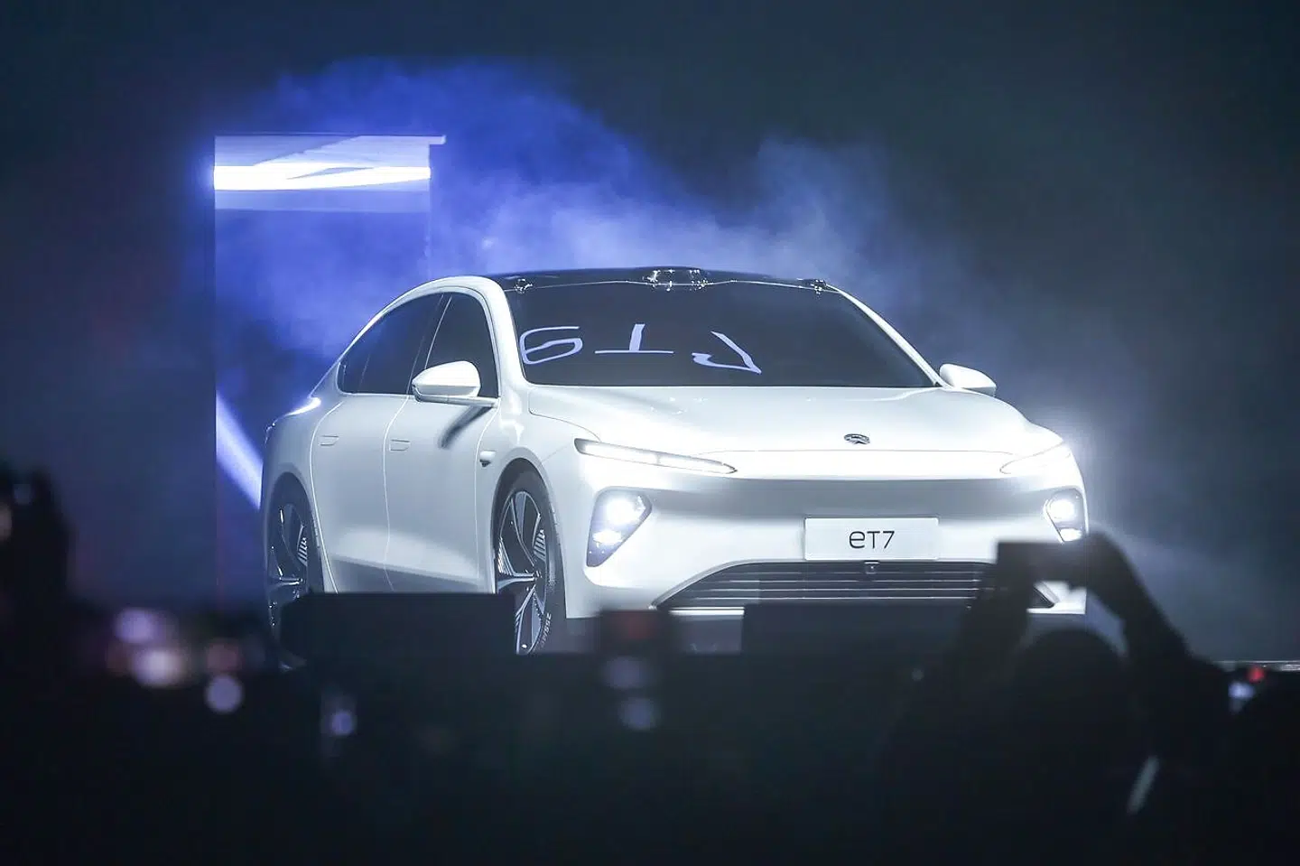 This photo taken on January 9, 2021 shows the NIO ET7, the flagship sedan for the Chinese electric car manufacturer, during its launch ceremony in Chengdu, in China's southwest Sichuan province. (Photo by STR / AFP) / China OUT