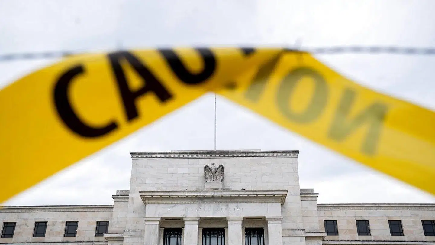 The US Federal Reserve building is seen past caution tape in Washington, DC, on September 19, 2022. - Stock markets wobbled following last week's rout as investors expect another big rate hike by the US Federal Reserve that they fear could drag down the global economy. (Photo by Stefani Reynolds / AFP)