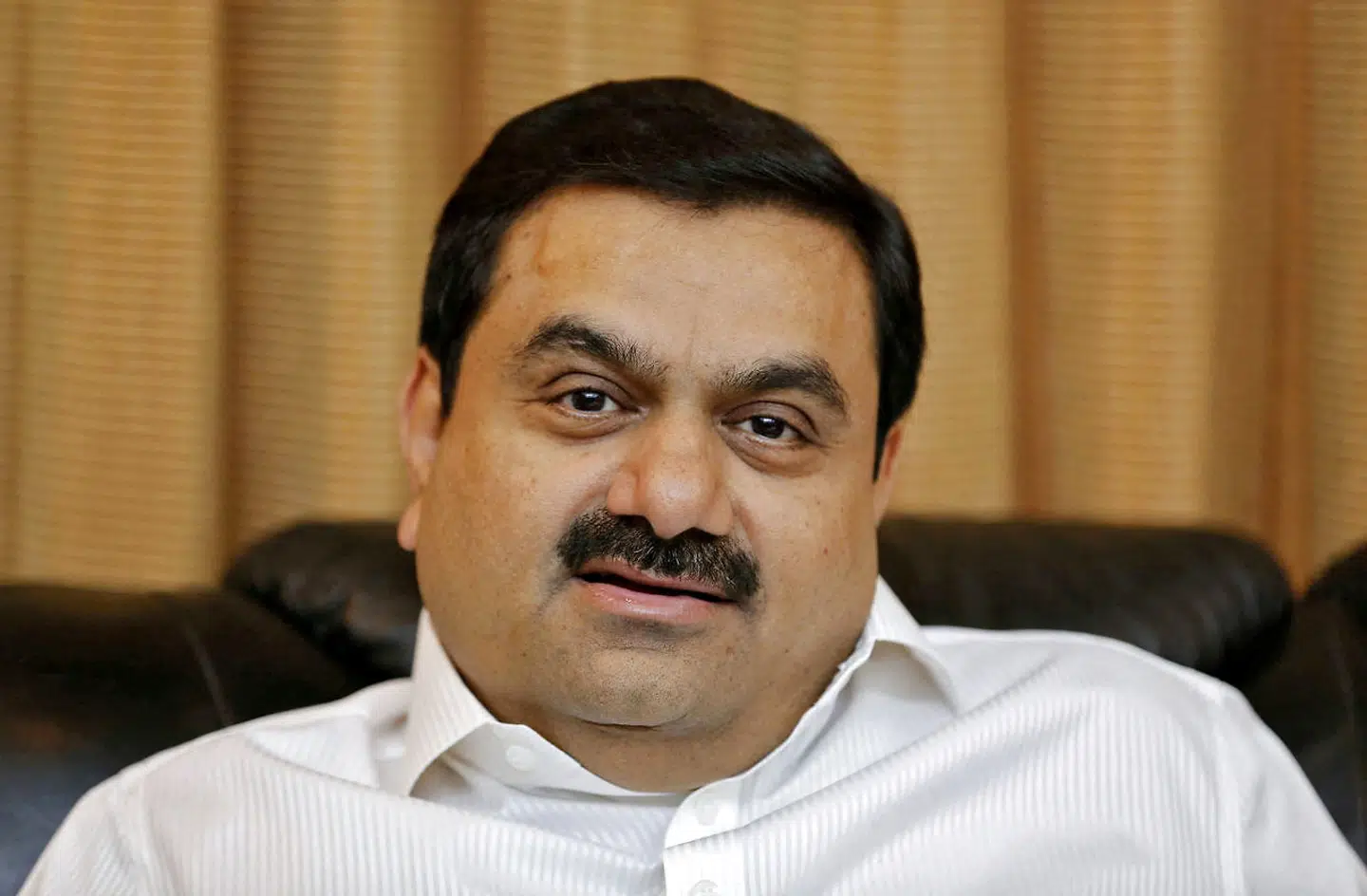 FILE PHOTO: Indian billionaire Gautam Adani speaks during an interview with Reuters at his office in the western Indian city of Ahmedabad in this April 2, 2014 file photo. REUTERS/Amit Dave/File Photo/File Photo