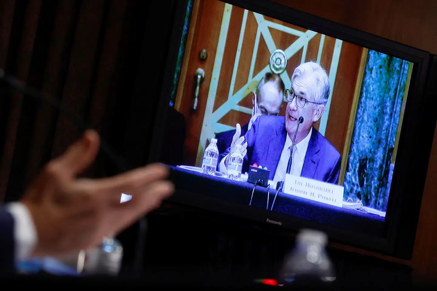 U.S. Federal Reserve Chair Jerome Powell is seen on a video screen as he testifies before a Senate Banking, Housing, and Urban Affairs Committee hearing on the Fed's "Semiannual Monetary Policy Report to the Congress, " on Capitol Hill in Washington, U.S., March 3, 2022. REUTERS/Jonathan Ernst/Pool