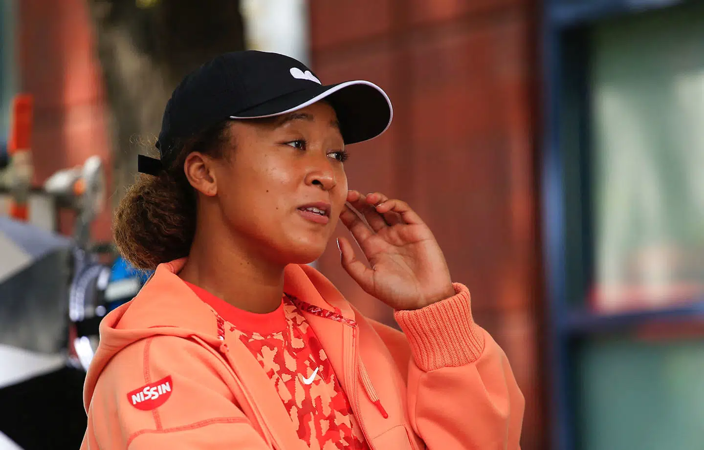 (FILES) In this file photo taken Japan's Naomi Osaka speaks during a interview ahead of the 2021 US Open Tennis tournament at the Billie Jean King Natinal Tennis Center in Queens, New York on August 27, 2021. - Naomi Osaka launches her bid for a third US Open title in four years on August 30, 2021, aiming to put turmoil behind her as she chases her second Grand Slam title of 2021.Osaka, who rocketed to fame when she beat superstar Serena Williams in the 2018 US Open final, appeared set for a sparkling 2021 campaign after she beat American Jen Brady in the Australian Open final in February to capture her fourth major crown. (Photo by Kena Betancur / AFP)