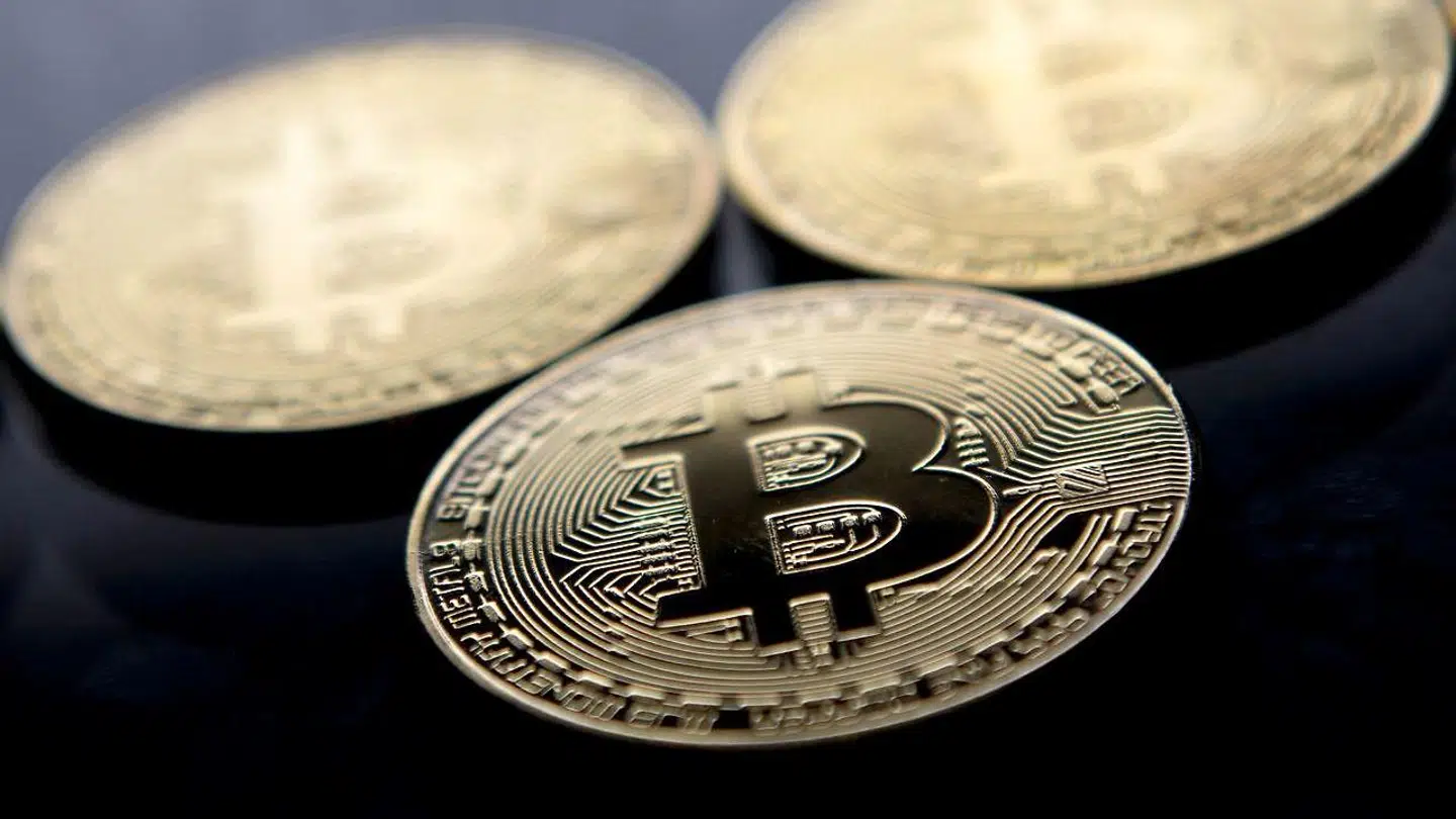 (FILES) This file photo taken on November 20, 2017 shows gold plated souvenir Bitcoin coins arranged for a photograph in London. - Bitcoin plunged below 39, 000 USD for the first time in more than three months on May 19, 2021 after China said cryptocurrencies would not be allowed in transactions and warned investors against speculative trading in them, despite the country powering most of the world's mining. (Photo by Justin TALLIS / AFP)