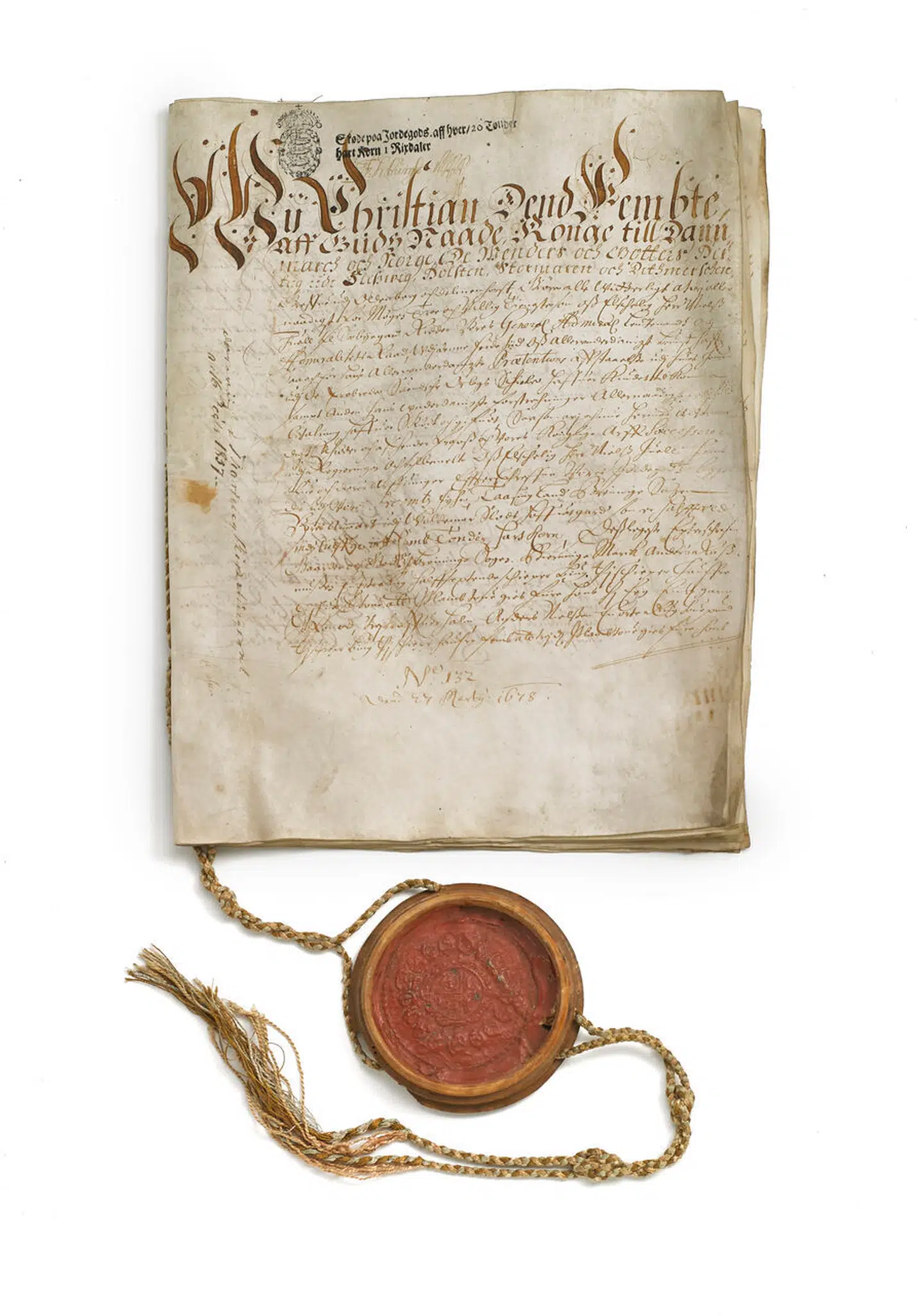 Det originale håndskrevne skøde, der opremser den danske konges overdragelser til admiral Niels Juel, nemlig part i Valdemars Slots hovedgård, bøndergodset og patronatsretten til Landet Kirke. Dateret »paa Vores Kongelige Residentz udi Kiöbenhaffn dend 14 Martij Anno 1678«. Skødet var vurderet til 20.000-30.000 kroner på auktionen.