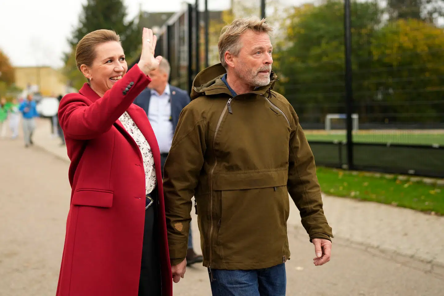 Danish Prime Minister Mette Frederiksen, left, and her husband Bo Tengberg walk before casting at a polling station in Hareskovhallen in Vaerloese, Denmark, on Tuesday, Nov 1, 2022. Denmark's election on Tuesday is expected to change its political landscape, with new parties hoping to enter parliament and others seeing their support dwindle. A former prime minister who left his party to create a new one this year could end up as a kingmaker, with his votes being needed to form a new government. (AP Photo/Sergei Grits)