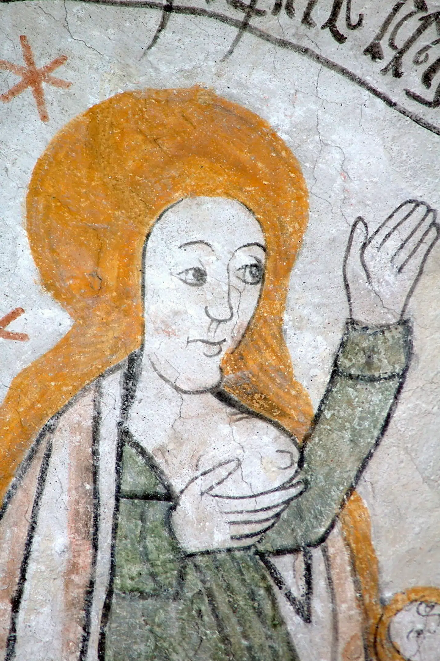 Kalkmaleri fra dansk kirke, der viser en kvinde, der blotter sit bryst.