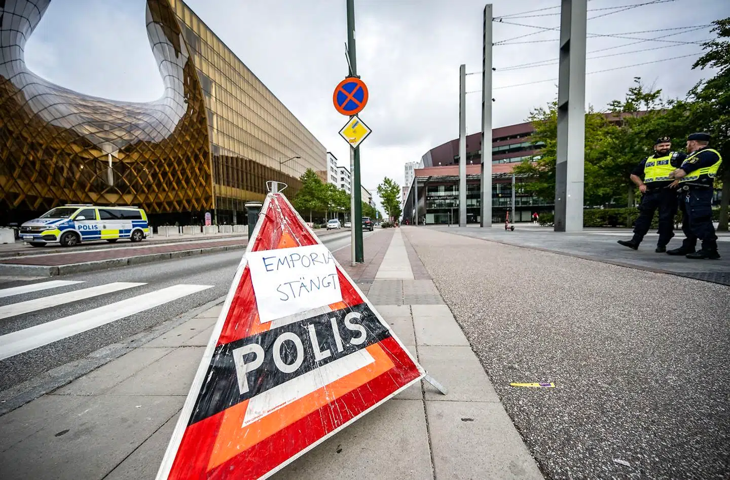 epa10130162 Police stands guard outside of Emporia Shopping Center in Malmo, Sweden, 20 August 2022. A 31 year-old man was shot to death and a woman was injured during a shooting in the shopping center. A 15 year-old boy was arrested by the police for the murder. The shopping center is closed today 20 August but will re-open on 21 August 2022. EPA/JOHN NILSSON SWEDEN OUT