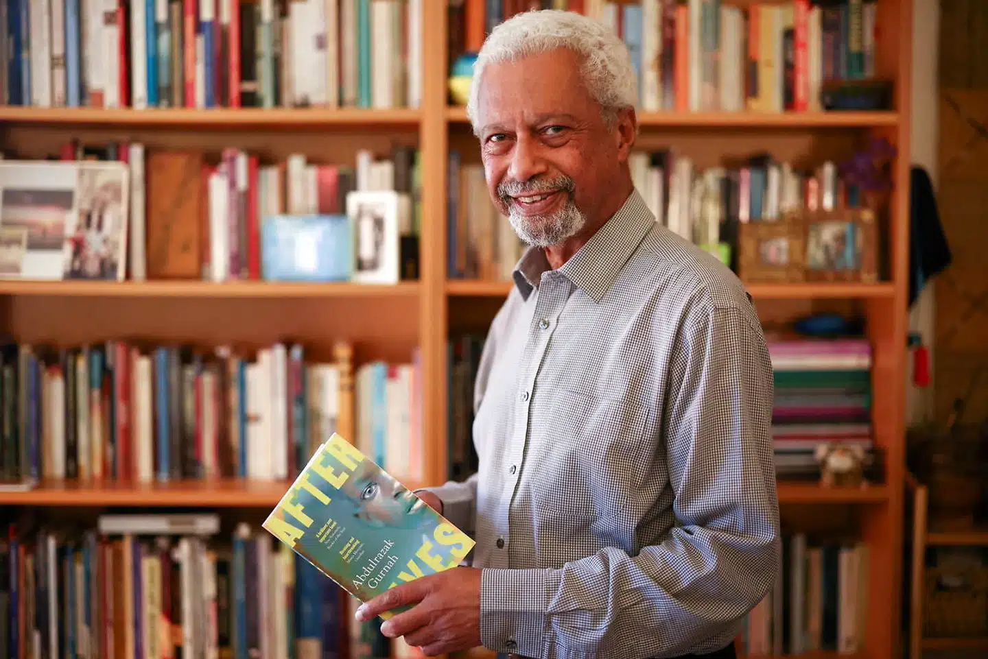 FILE PHOTO: Tanzanian novelist Abdulrazak Gurnah, winner of the 2021 Nobel Prize for Literature, poses at his home in Canterbury, Britain, October 7, 2021. REUTERS/Henry Nicholls/File Photo