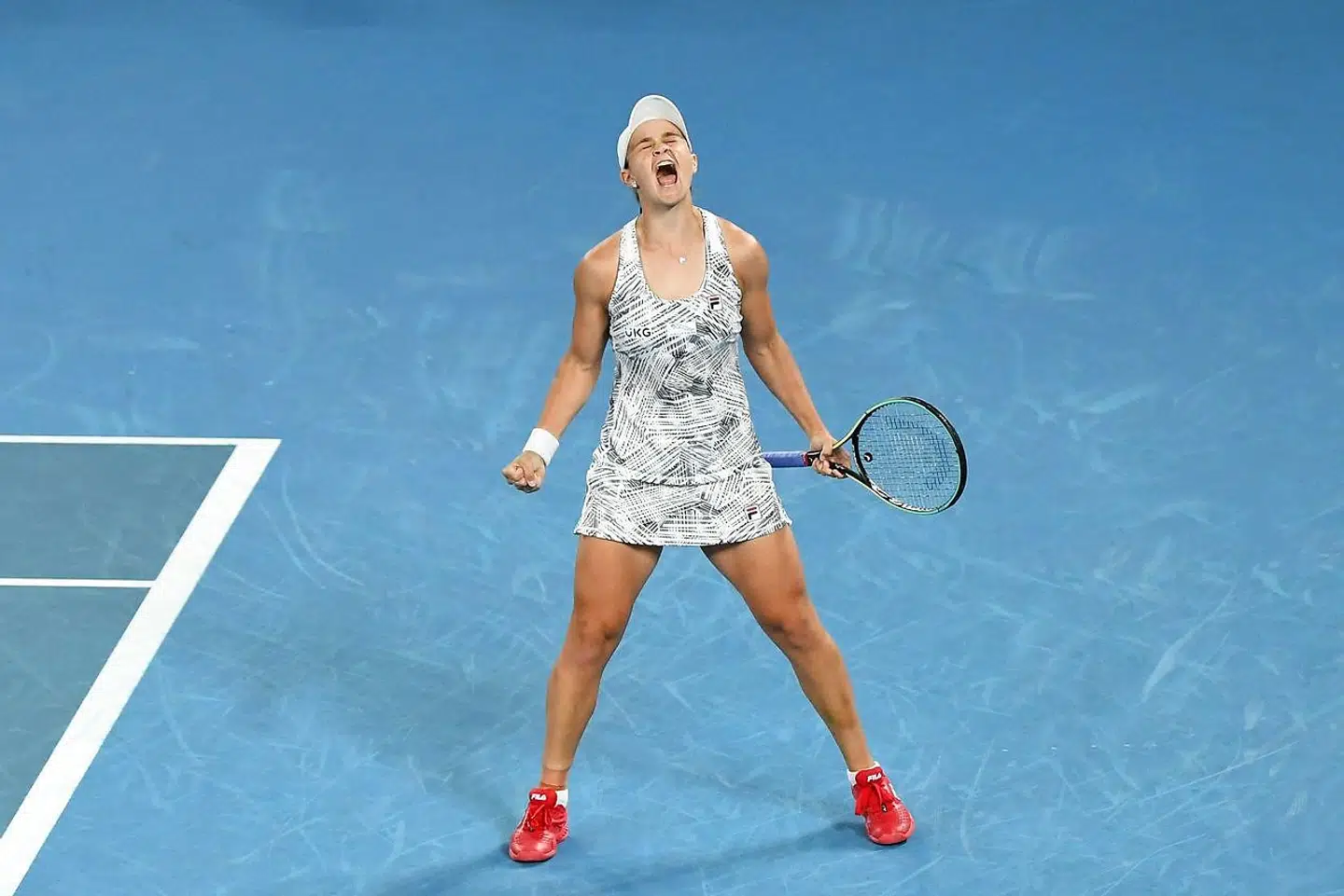 Australia's Ashleigh Barty reacts after winning against Danielle Collins of the US during their women's singles final match on day thirteen of the Australian Open tennis tournament in Melbourne on January 29, 2022. (Photo by William WEST / AFP) / - - IMAGE RESTRICTED TO EDITORIAL USE - STRICTLY NO COMMERCIAL USE - -