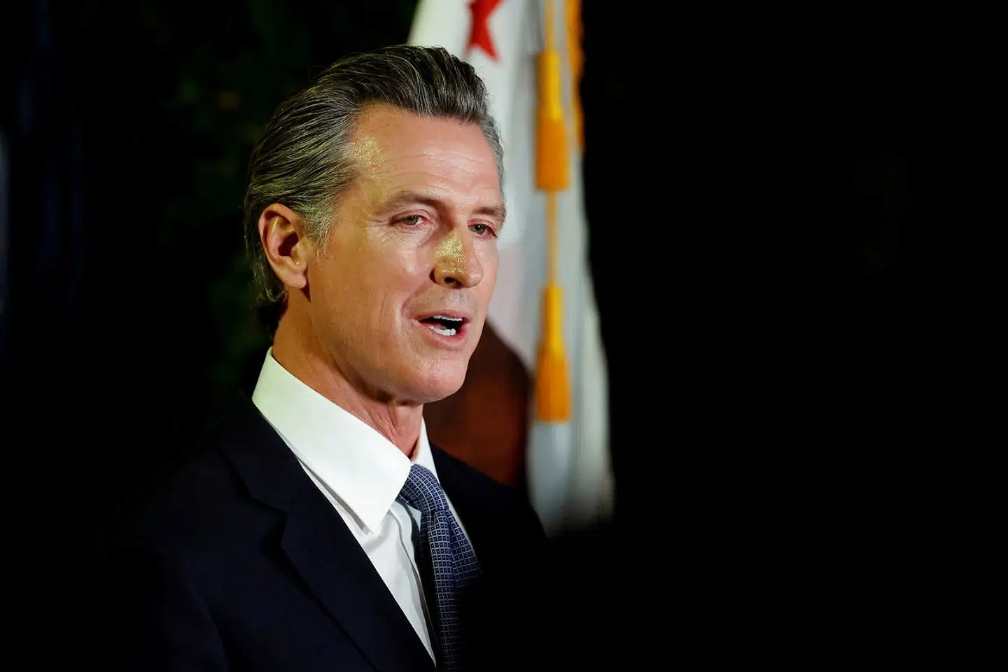 FILE PHOTO: California Governor Gavin Newsom makes an appearance after the polls close on the recall election, at the California Democratic Party headquarters in Sacramento, California, U.S., September 14, 2021. REUTERS/Fred Greaves/File Photo