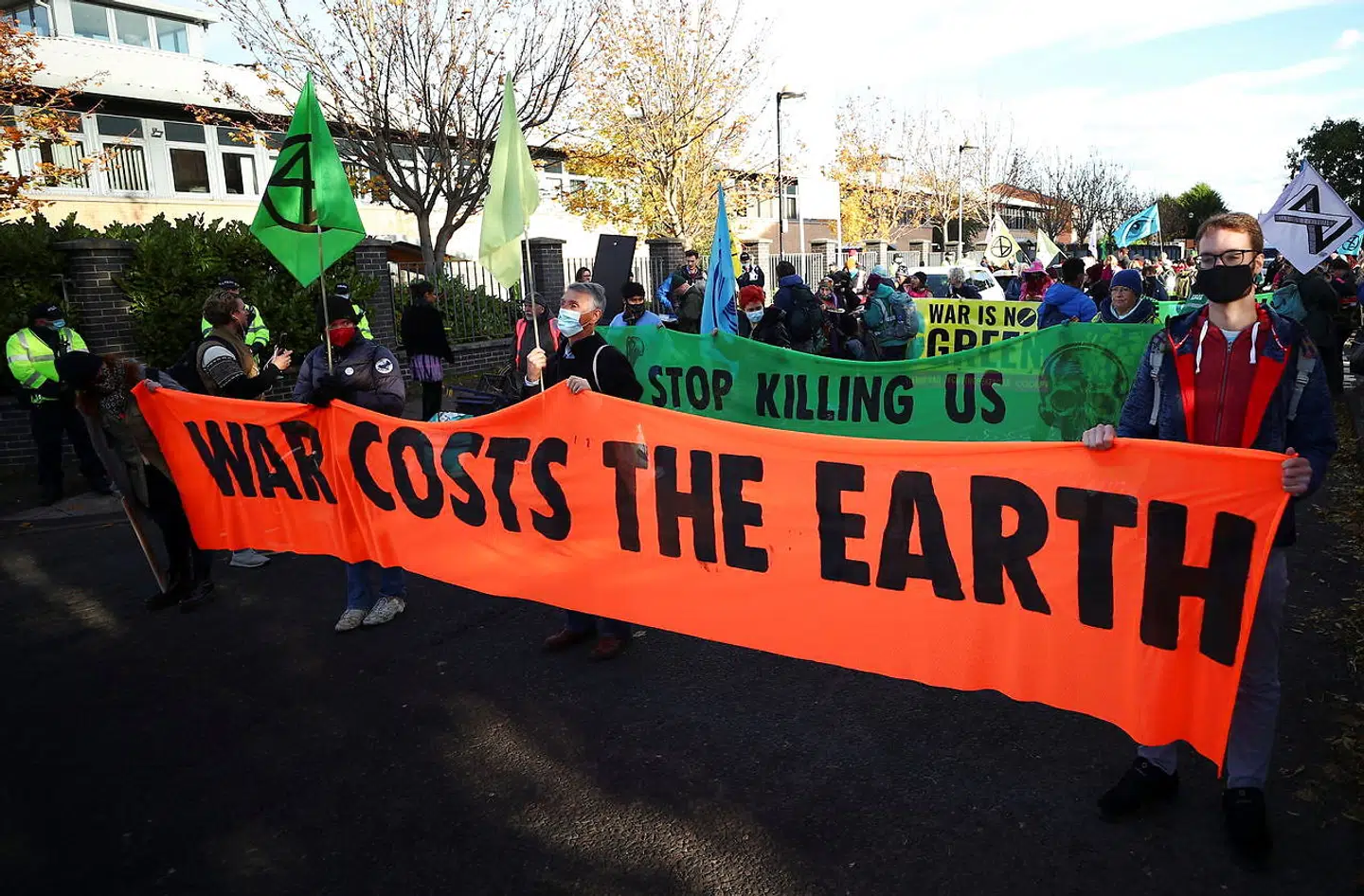Extinction Rebellion activists hold a sign during a protest, as the UN Climate Change Conference (COP26) takes place, in Glasgow, Scotland, Britain, November 4, 2021. REUTERS/Hannah McKay