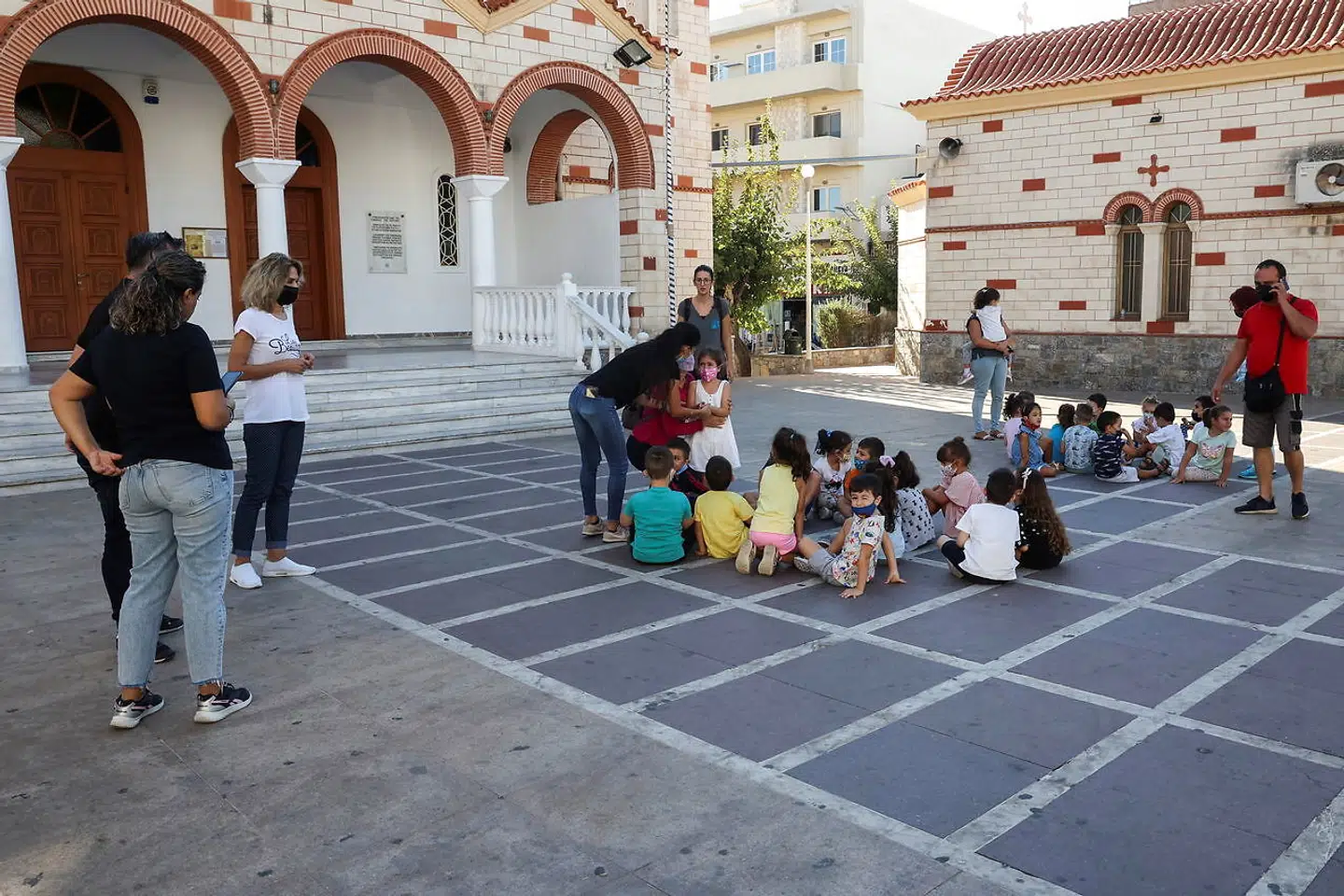 Students and their teachers are seen at a square following an earthquake in Heraklion, on the island of Crete, Greece, September 27, 2021. REUTERS/Stefanos Rapanis