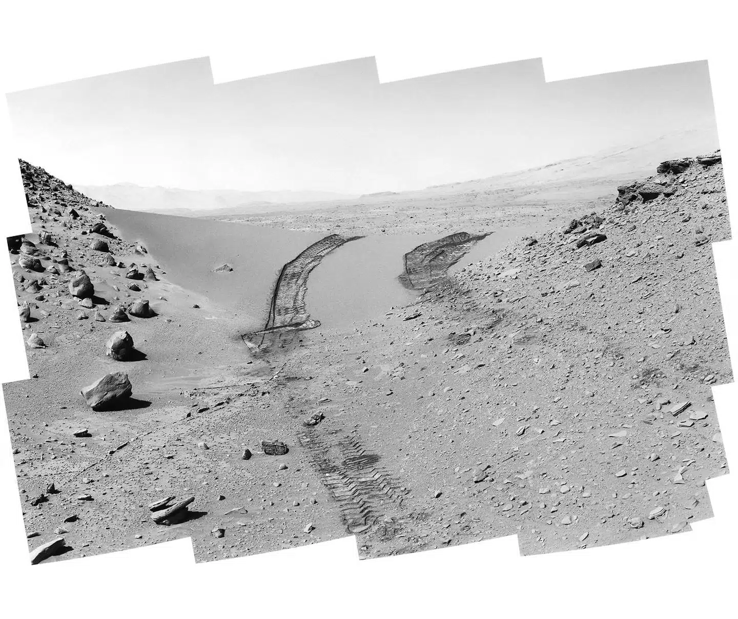 Curiosity's View of Martian Dune. Curiosity's work on Mars (Feb. 9, 2014). The rover had driven over the dune three days earlier. For scale, the distance between the parallel wheel tracks is about 9 feet (2.7 meters). The dune is about 3 feet (1 meter) tall in the middle of its span across an opening called "Dingo Gap."