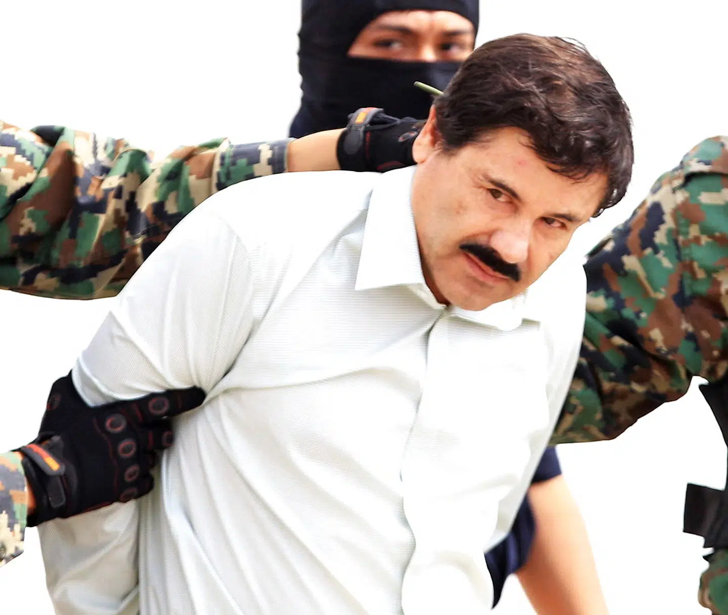 Narkogangsteren Joaquin »El Chapo« Guzman, da han blev anholdt og fængslet første gang i 2014. Nu står hans unge kone anklaget for at have arrangeret hans flugt året efter. Arkivfoto: Mario Guzman/Ritzau Scanpix