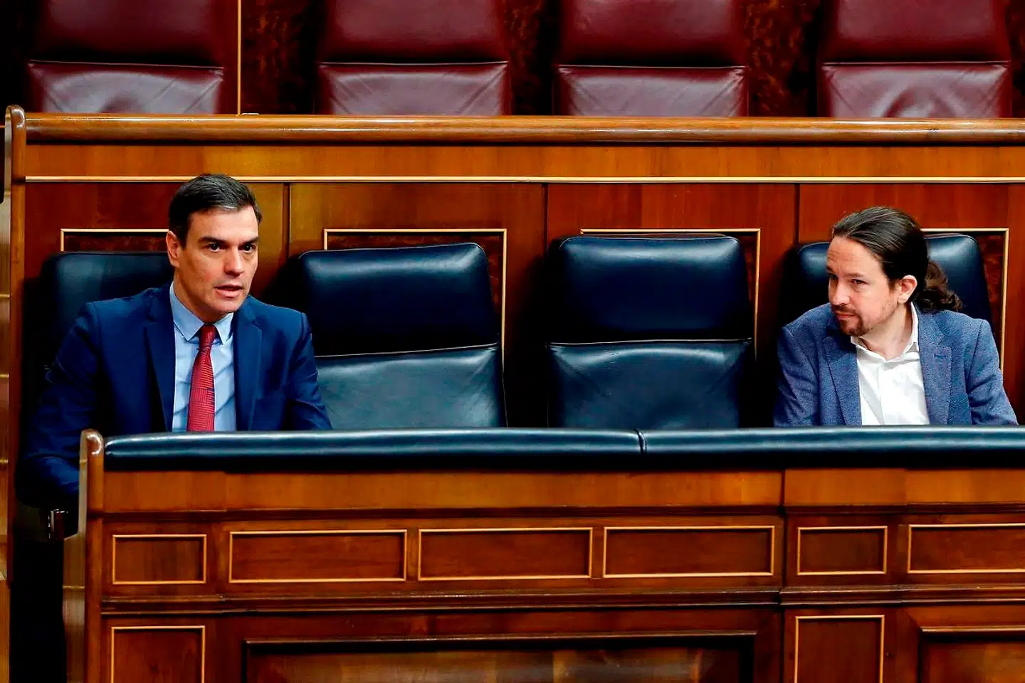 Spaniens socialdemokratiske premierminister Pedro Sánchez og Podemos-lederen Pablo Iglesias er et umage par og en torn i øjet på mange magtfulde spaniere, der vejrer morgenluft ved udsigten til en italiensk regering ledet af Mario Draghi.
