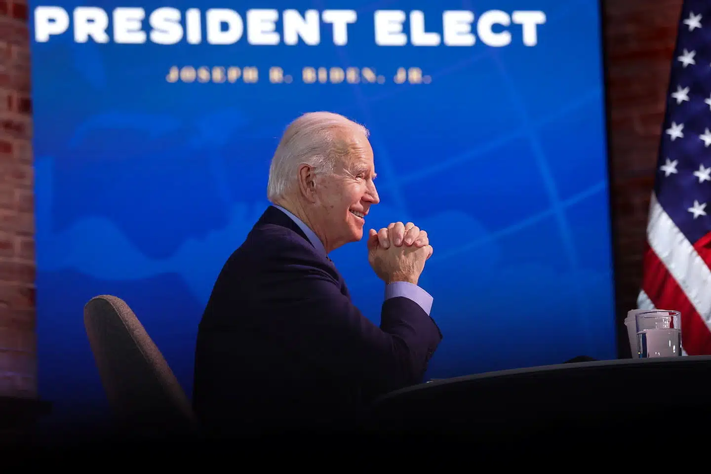 U.S. President-elect Joe Biden smiles during a national security conference video call at his transition headquarters in Wilmington, Delaware, U.S. December 28, 2020. REUTERS/Jonathan Ernst