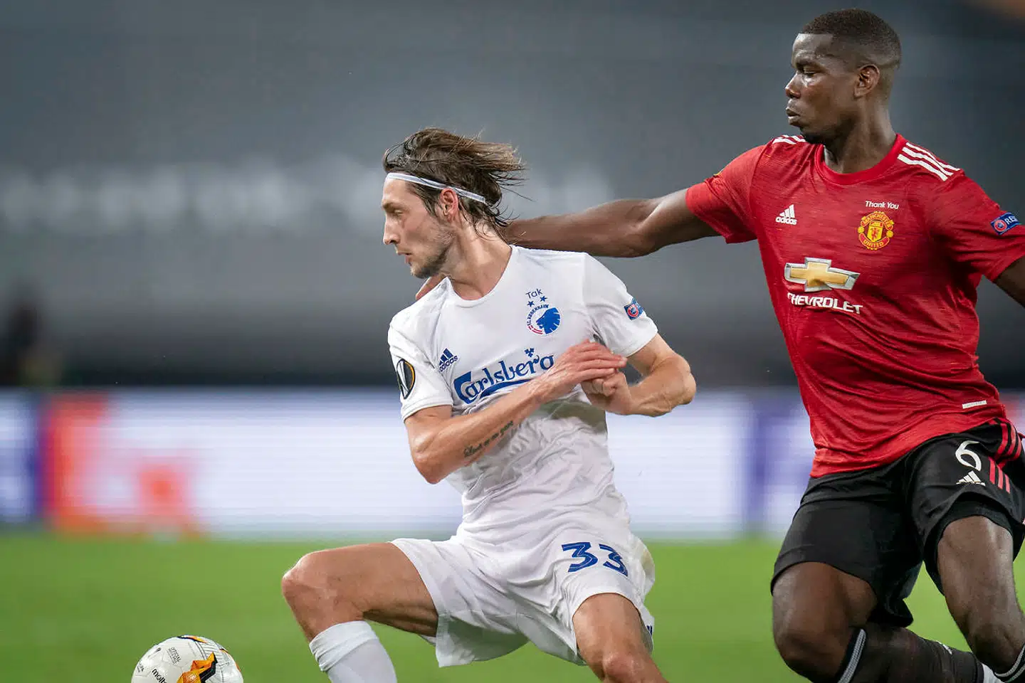FCKs Rasmus Falk og Paul Pogba under Europa League kampen mellem FCK-Manchester United på RheinEnergieStadion i Køln mandag den 10 august 2020.. (Foto: Liselotte Sabroe/Ritzau Scanpix)