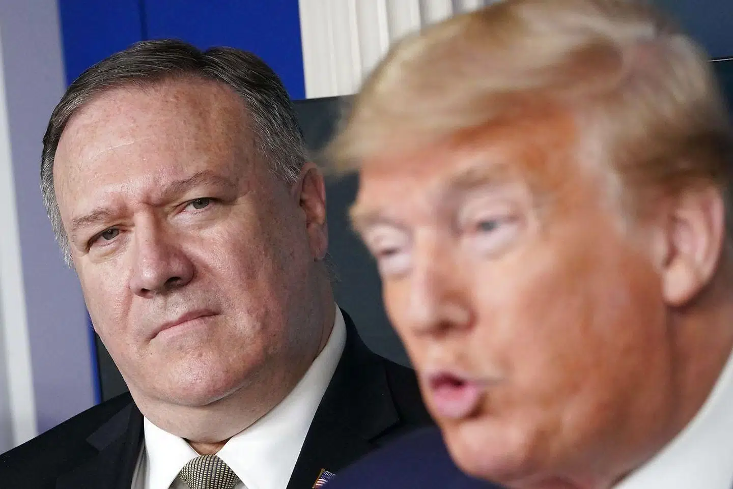 USAs præsident, Donald Trump, og udenrigsminister Mike Pompeo (til venstre) har ad flere omgange beskyldt WHO for at være pro-Kina.