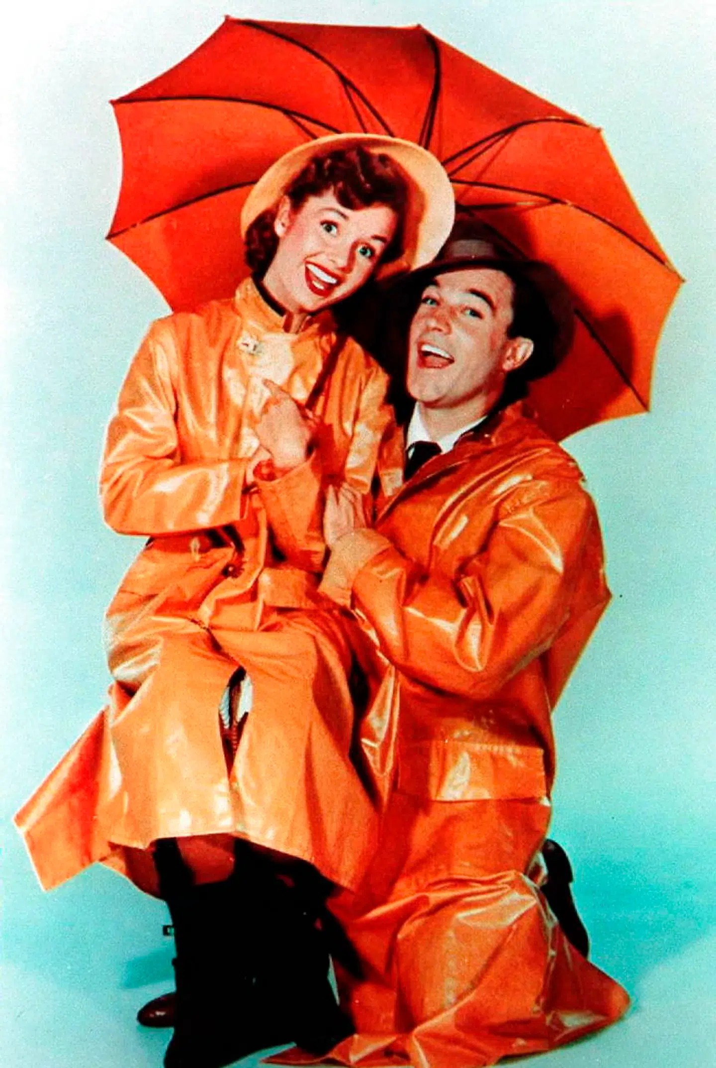 Gene Kelly havde feber, da han dansede til den berømteste sang fra »Singin' in the Rain«. Her er han med Debbie Reynolds.