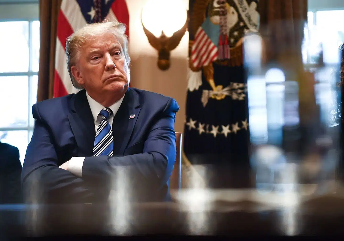 TOPSHOT - US President Donald Trump speaks during a meeting with banking leaders to discuss how the financial services industry can meet the needs of customers affected by COVID-19 at the White House in Washington, DC on March 11, 2020. (Photo by Brendan Smialowski / AFP)