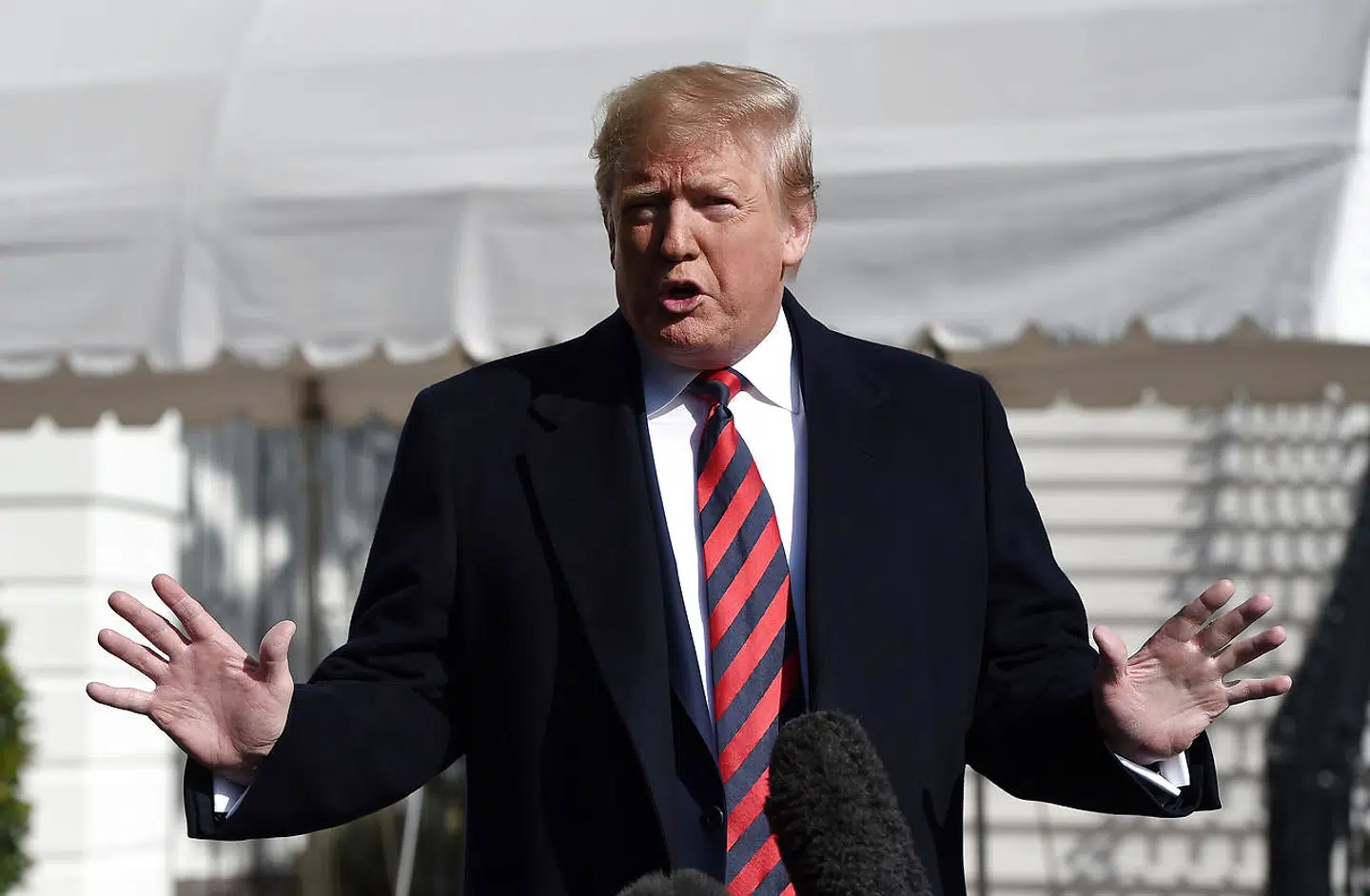 US President Donald Trump speaks to members of the media on the South Lawn of the White House in Washington DC as he departs for Tuscaloosa, Alabama on November 9, 2019. - Trump and First Lady Melania are attending the Louisiana State University Tigers vs. Alabama Crimson Tide Football Game. (Photo by Olivier Douliery / AFP)