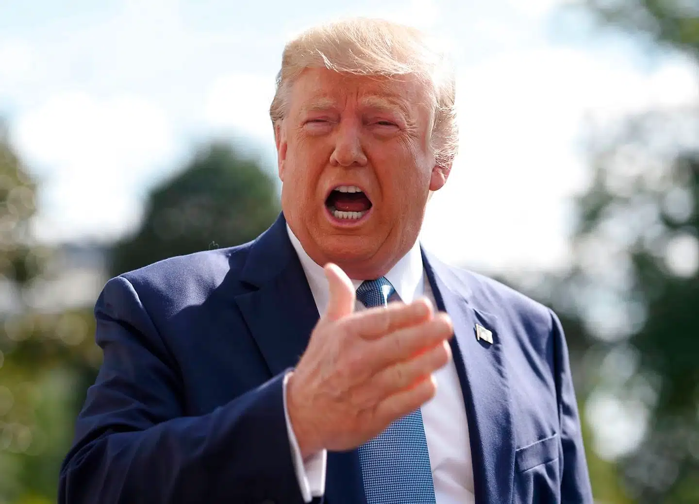 US President Donald Trump speaks to the press as he departs the White House in Washington, DC, for his annual visit to Walter Reed National Military Medical Center, on October 4, 2019. - A defiant Trump refused to confirm Friday that he will cooperate with an impeachment investigation in Congress. "I don't know, that's up to the lawyers, " he said at the White House. (Photo by Andrew CABALLERO-REYNOLDS / AFP)