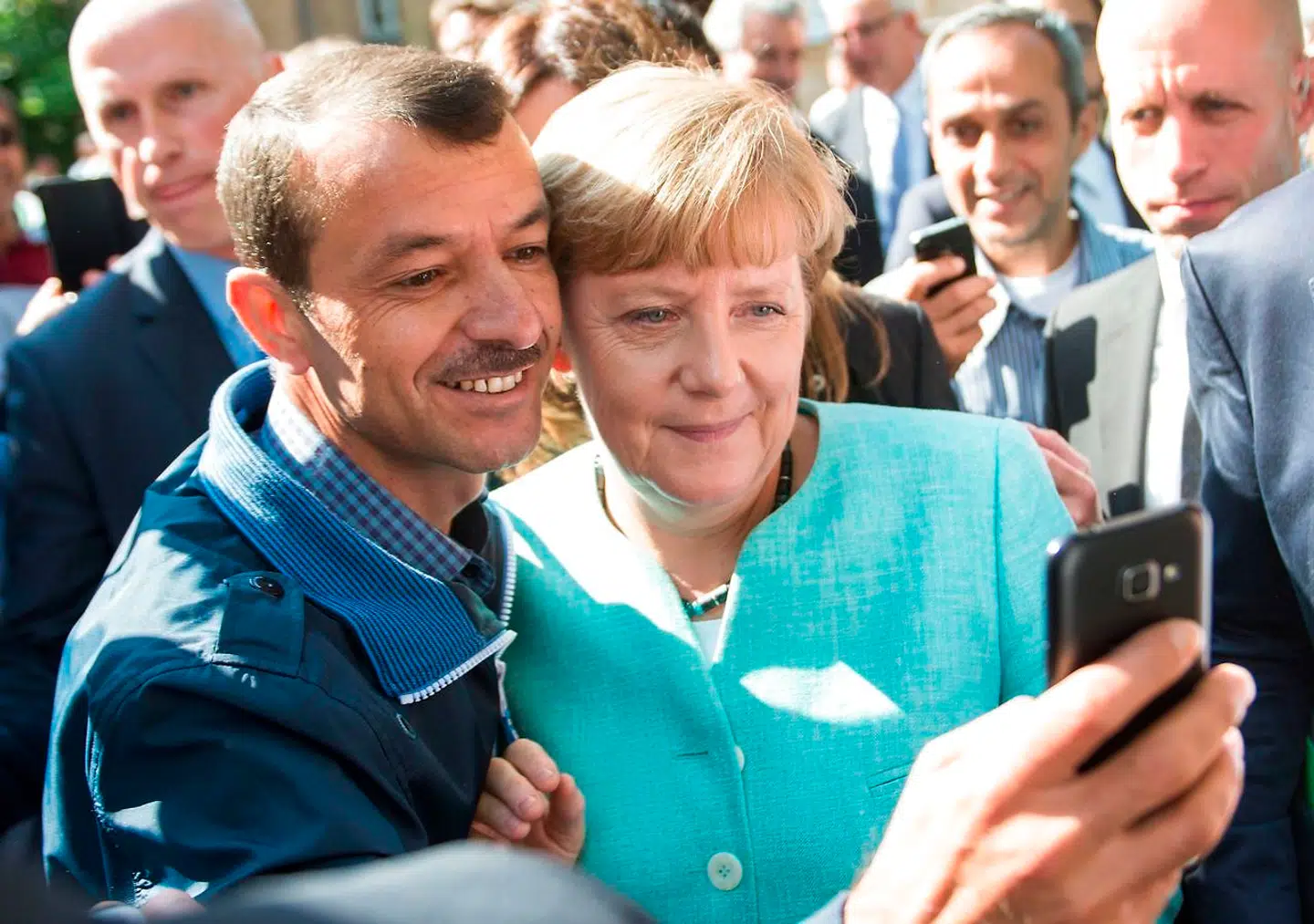 Dette billede af kansler Merkel og en asylansøger fra september 2015 gik verden rundt.