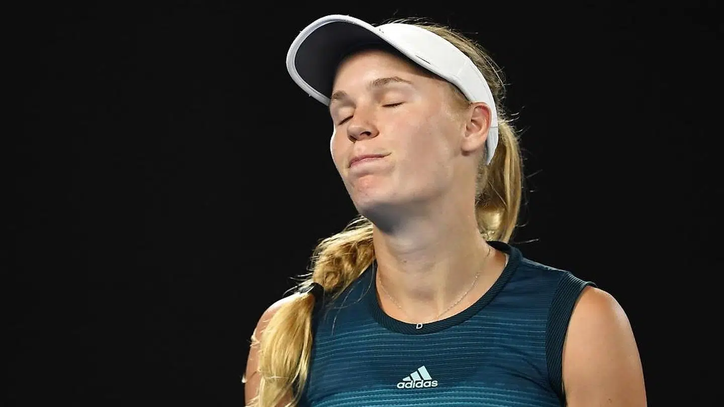 epa07295307 Caroline Wozniacki of Denmark in action against Maria Sharapova of Russia during their round three women's singles match on day five of the Australian Open Grand Slam tennis tournament in Melbourne, Australia, 18 January 2019. EPA/LUKAS COCH EDITORIAL USE ONLY AUSTRALIA AND NEW ZEALAND OUT