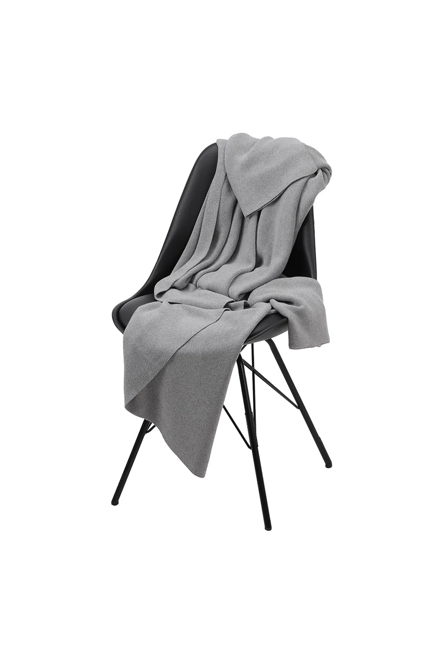 Rikke Rasmussen elsker det bløde og holdbare. Tæppe i økologisk bomuld fra Moshi Moshi Mind, 1.699 kr.