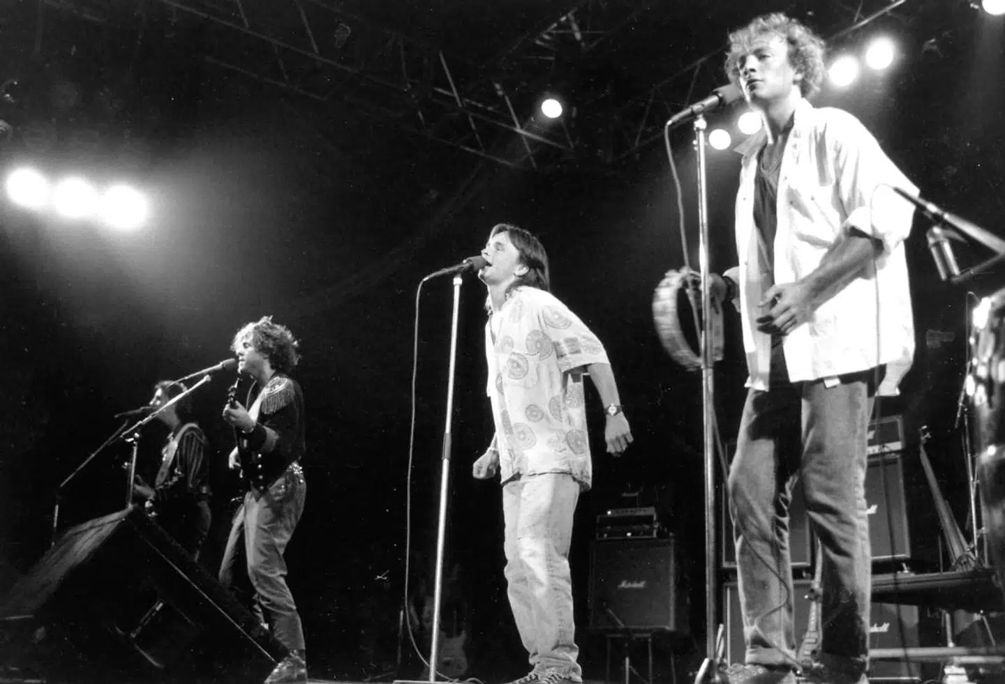 Jørgen Klubien, Jacob Andersen og i baggrunden Aske Jacoby, der spillede med bandet live i de første år, på scenen som helt unge.