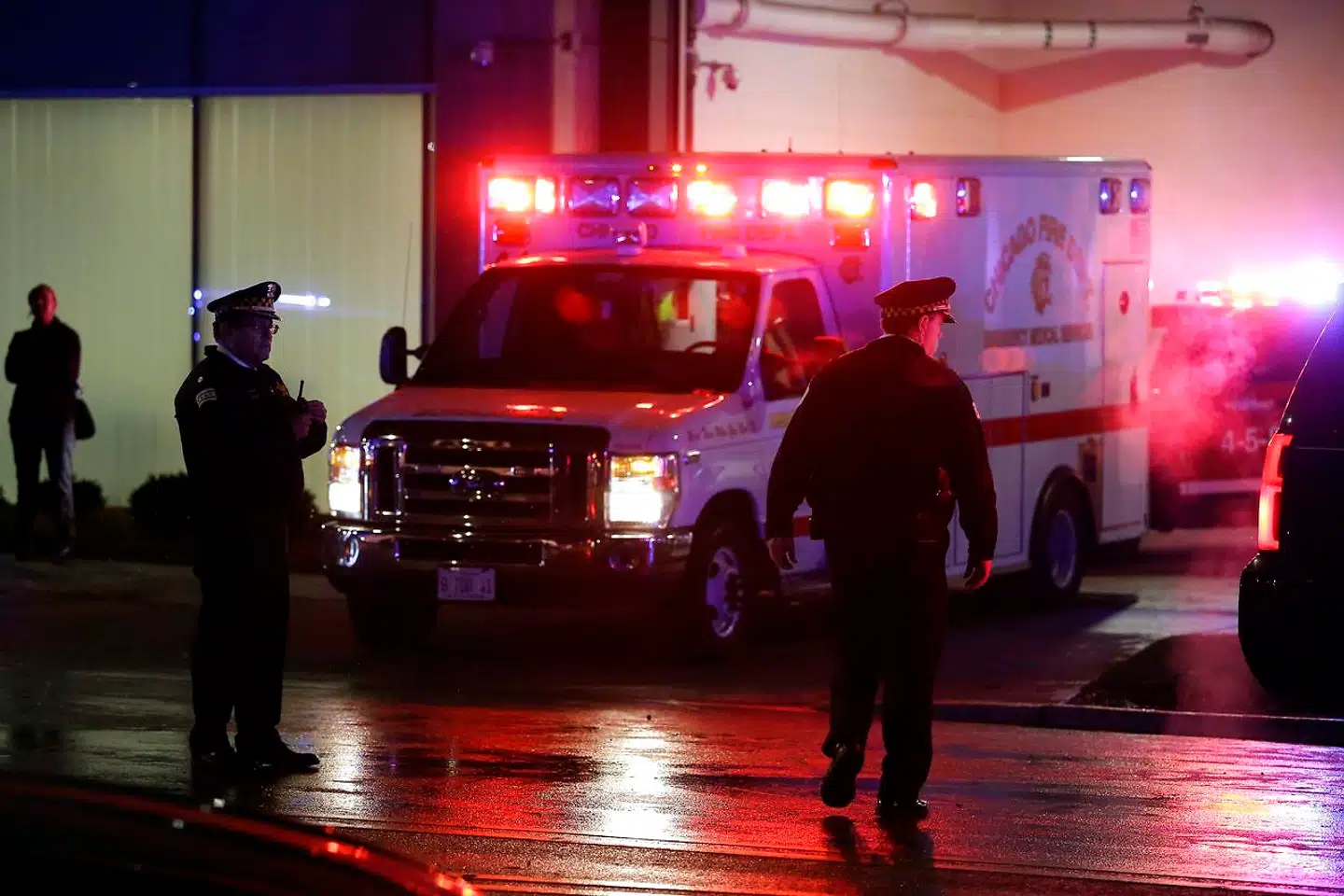 CHICAGO, IL - NOVEMBER 19: Chicago police officers stand outside the University of Chicago Hospital as the ambulance bearing the body of Chicago police officer Samuel Jimenez is escorted to the morgue November 19, 2018 in Chicago, Illinois. Three people including a Chicago police officer Jimenez were killed when a gunman went on a rampage at Mercy Hospital. Joshua Lott/Getty Images/AFP == FOR NEWSPAPERS, INTERNET, TELCOS & TELEVISION USE ONLY ==