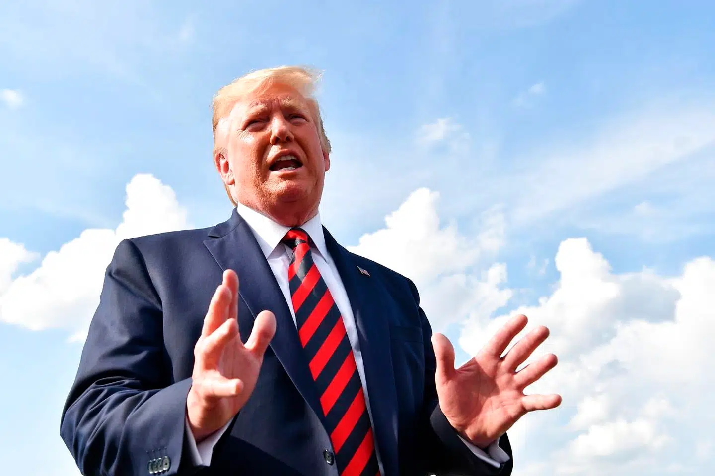 US President Donald Trump speaks to the press before boarding Air Force One in Morristown, New Jersey, on August 18, 2019. (Photo by Nicholas Kamm / AFP)