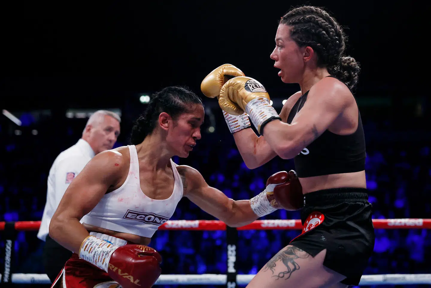 Boxing - Amanda Serrano v Sarah Mahfoud - IBF, IBO, WBC & WBO World Featherweight Titles - AO Arena, Manchester, Britain- September 24, 2022 Amanda Serrano in action with Sarah Mahfoud Action Images via Reuters/Andrew Couldridge