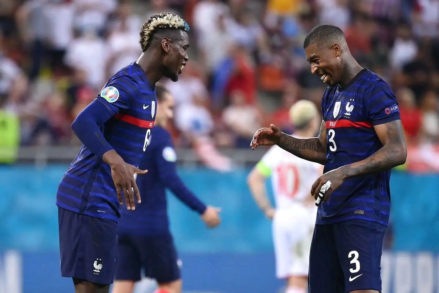 France's midfielder Paul Pogba (L) celebrates with France's defender Presnel Kimpembe (R) after scoring the third goal during the UEFA EURO 2020 round of 16 football match between France and Switzerland at the National Arena in Bucharest on June 28, 2021. (Photo by FRANCK FIFE / POOL / AFP)