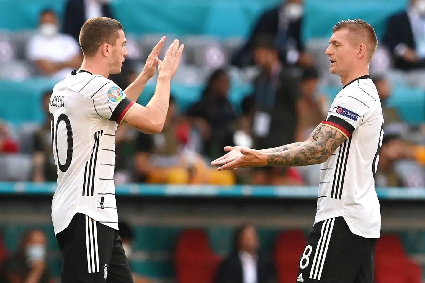 Germany's defender Robin Gosens (L) reacts with Germany's midfielder Toni Kroos before the UEFA EURO 2020 Group F football match between Portugal and Germany at Allianz Arena in Munich, Germany, on June 19, 2021. (Photo by CHRISTOF STACHE / POOL / AFP)