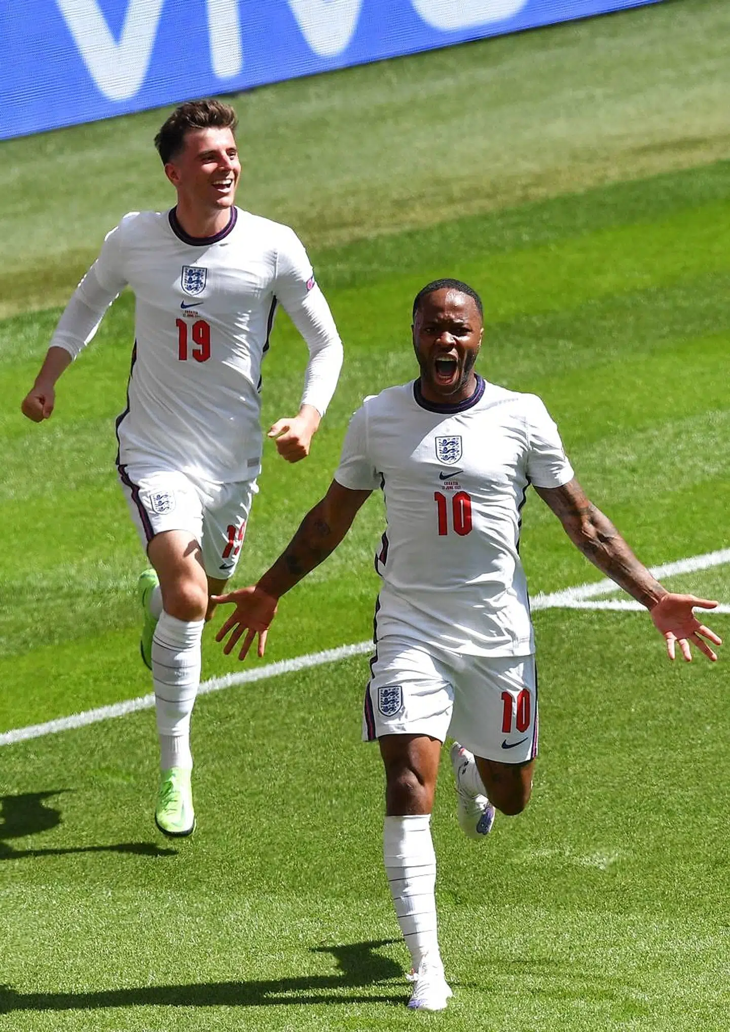 England's forward Raheem Sterling (R) celebrates scoring the team's first goal during the UEFA EURO 2020 Group D football match between England and Croatia at Wembley Stadium in London on June 13, 2021. (Photo by JUSTIN TALLIS / POOL / AFP)
