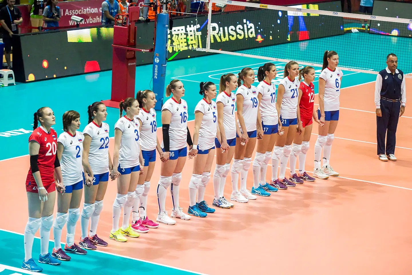Russia volleyball team players stand as they sing their national anthem prior to the Women's Volleyball World Grand Prix match between Russia and Serbia in Hong Kong on July 21, 2017. ISAAC LAWRENCE / AFP