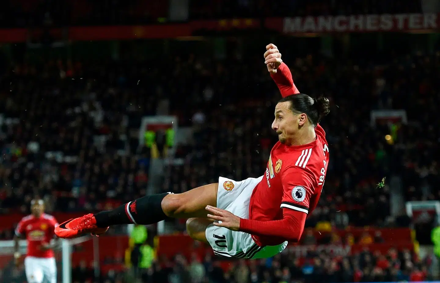 (FILES) In this file photo taken on November 18, 2017 Manchester United's Swedish striker Zlatan Ibrahimovic attempts a bicycle kick shot which was saved during the English Premier League football match between Manchester United and Newcastle at Old Trafford in Manchester, north west England, on November 18, 2017. - Zlatan Ibrahimovic has revealed he was told by "everyone" not to risk his reputation by playing in England but how a successful spell at Manchester United made him feel young again - - "like Benjamin Button". (Photo by Oli SCARFF / AFP) / RESTRICTED TO EDITORIAL USE.No use with unauthorized audio, video, data, fixture lists, club/league logos or 'live' services. Online in-match use limited to 75 images, no video emulation.No use in betting, games or single club/league/player publications. /