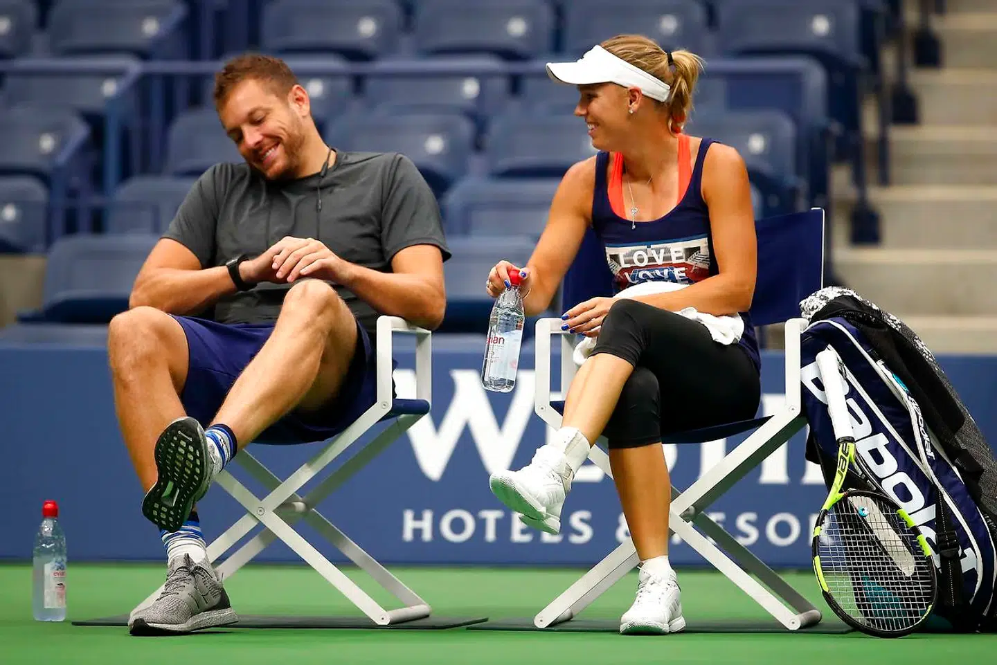 Caroline Wozniacki sammen med David Lee i en pause under et træningspas før Grand Slam-tennisturneringen US Open i fjor i New York.