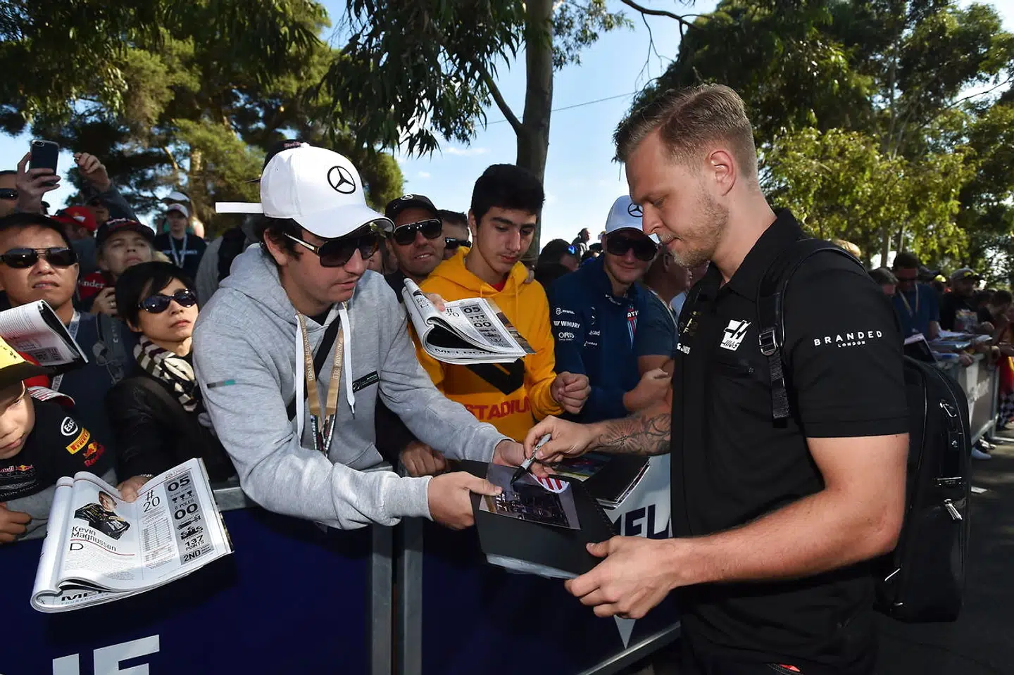 epa07435344 Danish driver Kevin Magnussen (R) of the Haas team arrives to day one of the Formula 1 2019 Australian Grand Prix at the Albert Park Grand Prix Circuit in Melbourne, Australia, 14 March 2019. EPA/JAMES ROSS AUSTRALIA AND NEW ZEALAND OUT