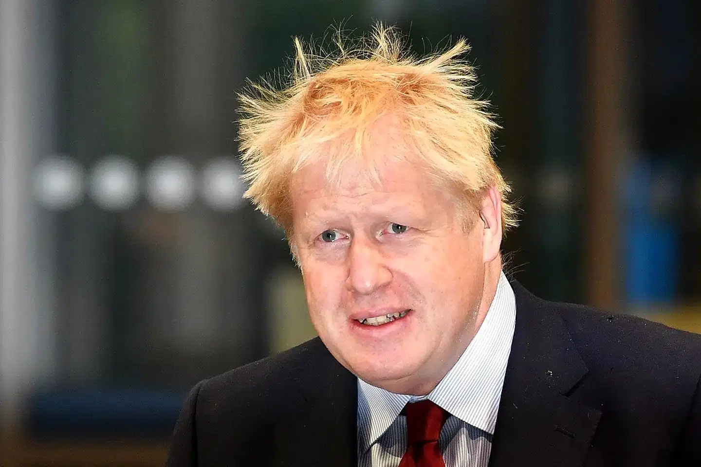 Britain's Prime Minister Boris Johnson arrives at the Manchester Central convention complex to give media interviews ahead of the third day of the annual Conservative Party conference, in Manchester, north-west England on October 1, 2019. - Britain's Boris Johnson is known for his colourful love life but the accusation he grabbed a young woman's thigh when he was a magazine editor risks a scandal as he seeks to unite his party over Brexit. (Photo by Ben STANSALL / AFP)
