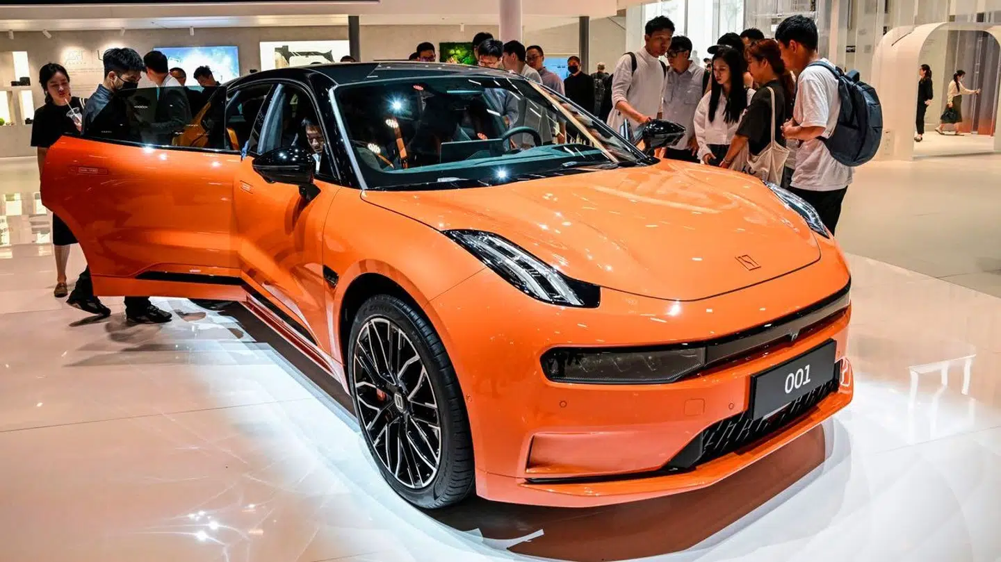 People look at a Zeekr 001 during the 20th Shanghai International Automobile Industry Exhibition in Shanghai on April 18, 2023. Hector RETAMAL / AFP