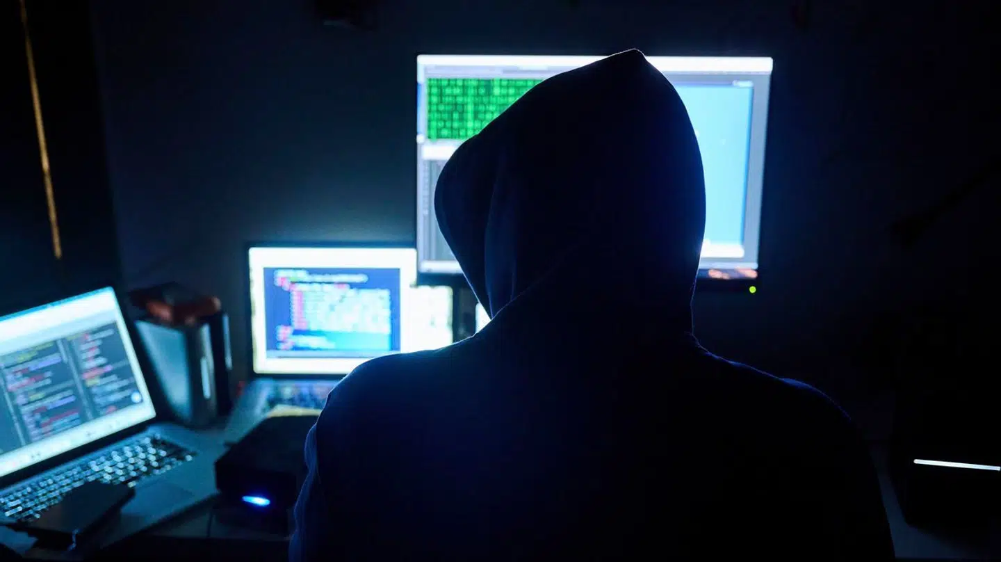 PRODUCTION – 12 February 2023, Berlin: Illustration: Fictitious html pages and hacker programs are seen on screenes while a man has his hands on the keyboard. Photo by: Annette Riedl/picture-alliance/dpa/AP Images